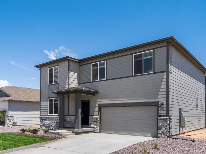 Front exterior of a new home in Poudre Heights: The Lakes Collection, Windsor, CO, highlighting curb appeal (Image 22).
