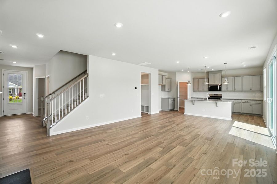 open concept foyer, gathering room and kitchen