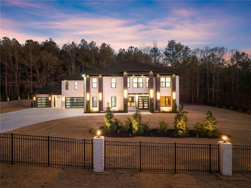 Front exterior of a new home in , Hoschton, GA, highlighting curb appeal (Image 40).