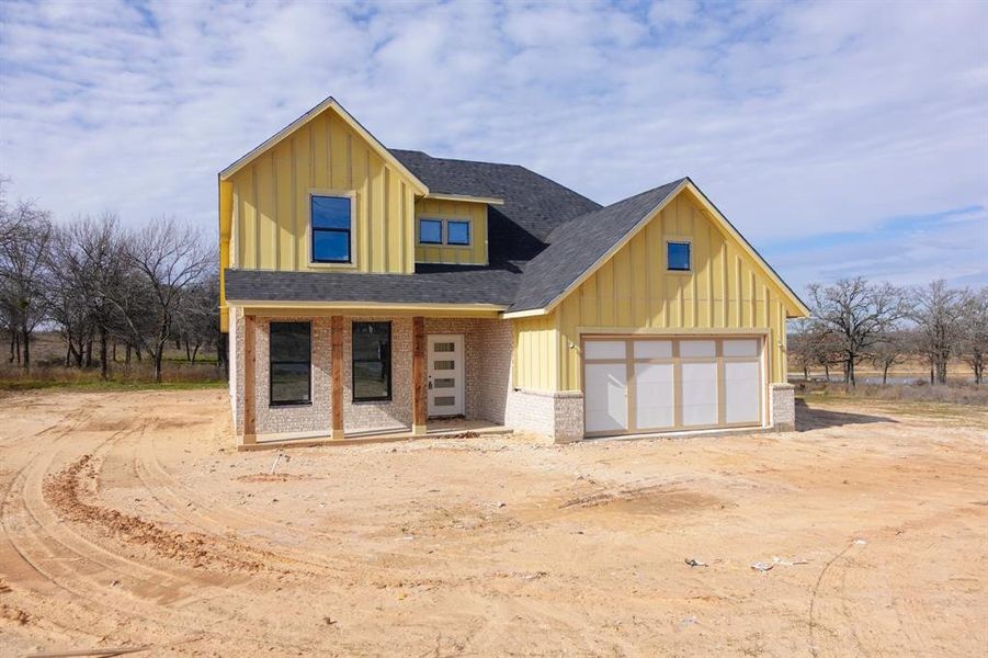 View of front of property featuring a garage