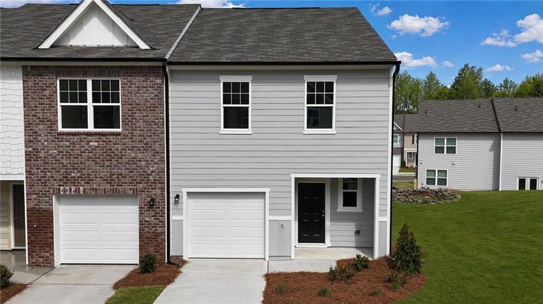 Front exterior of a new home in Kingston Cove, Auburn, GA, highlighting curb appeal (Image 6).