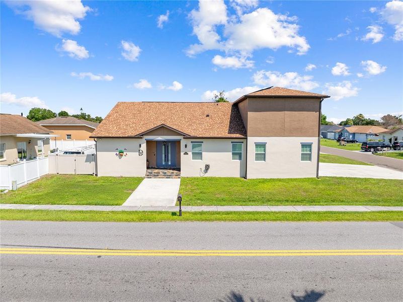Front exterior of a new home in , Kissimmee, FL, highlighting curb appeal (Image 26). Front exterior of a new home in , Kissimmee, FL, highlighting curb appeal (Image 26).