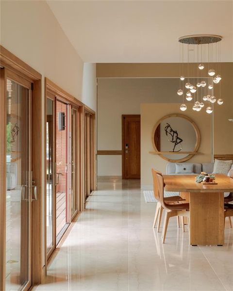 Dining space featuring light marble finish flooring