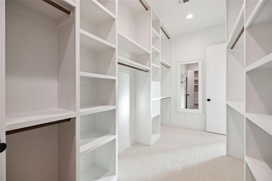 Spacious closet with carpet floors