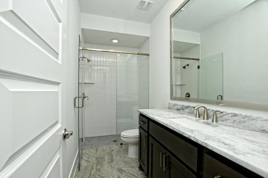 Representative furnished interior of a home built from the Madera II by Giddens Homes in Scofield Farms Estates, Georgetown (Image 283).