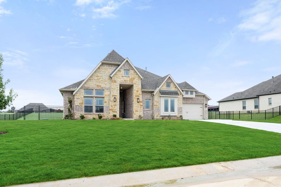 Single-story home with stone and brick exterior, one-car garage, and large front lawn