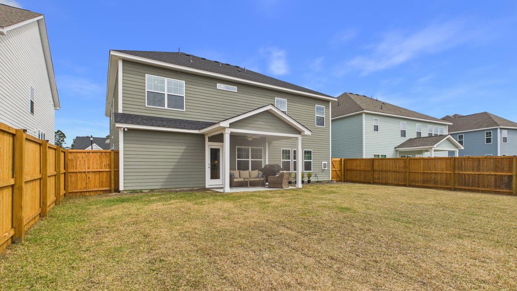 Exterior details and patio area of a home in Hewing Farms, Summerville (Image 4).