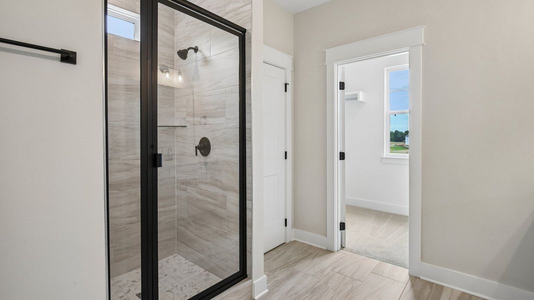 Primary bathroom with glass enclosed shower Primary bathroom with glass enclosed shower