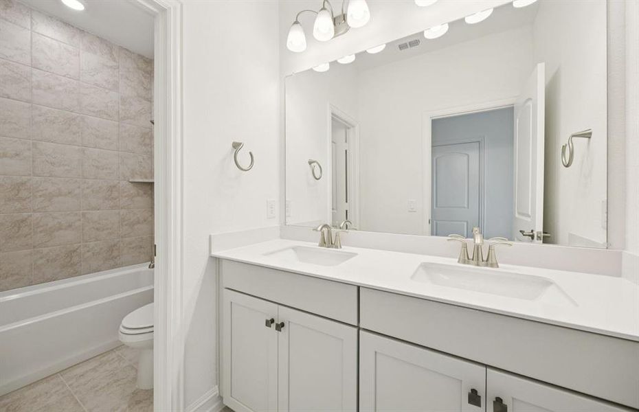 Upgraded secondary bath with elegant finishes *Real home pictured Upgraded secondary bath with elegant finishes *Real home pictured