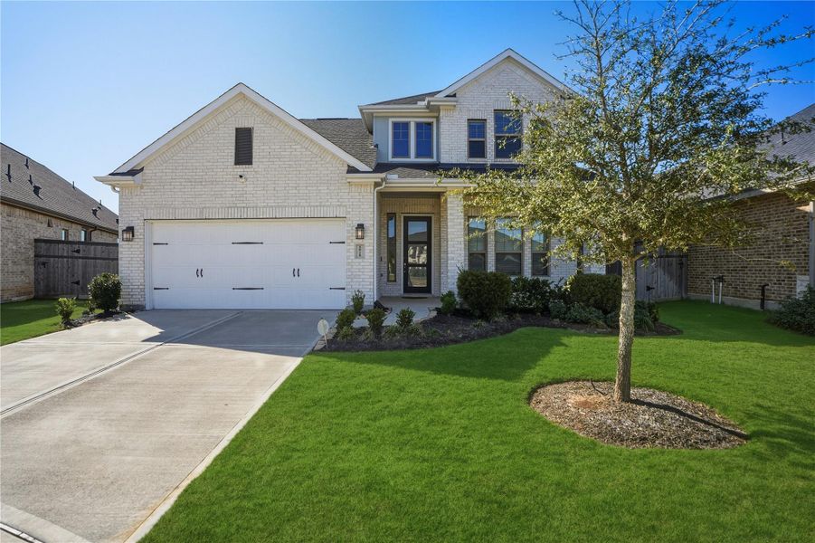 Front exterior of a new home in , Fulshear, TX, highlighting curb appeal (Image 27). Front exterior of a new home in , Fulshear, TX, highlighting curb appeal (Image 27).