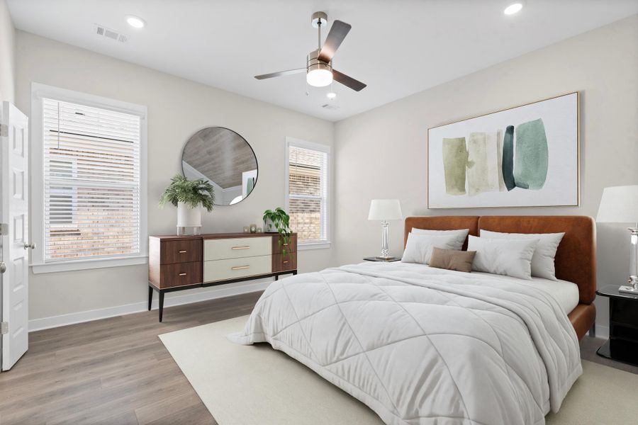 Wood-finish flooring, recessed lighting, and a ceiling fan with light fixture