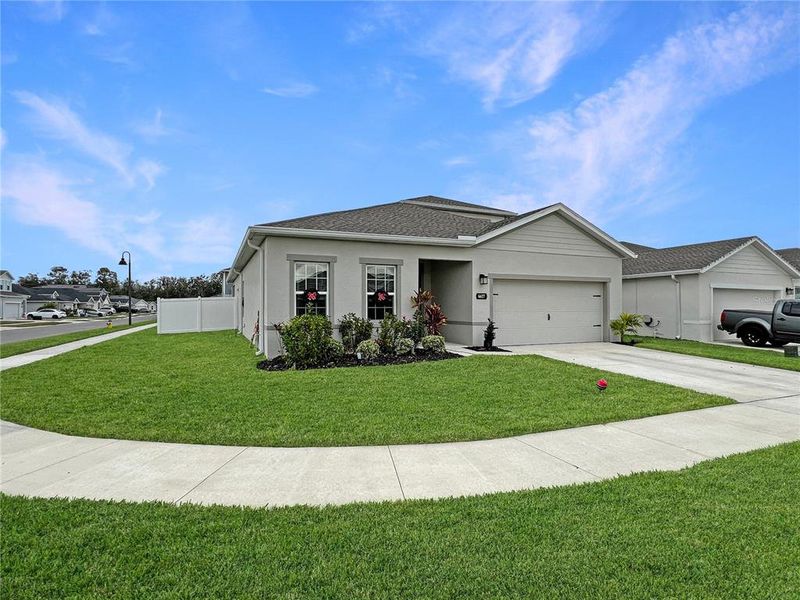 Front exterior of a new home in , Zephyrhills, FL, highlighting curb appeal (Image 22).