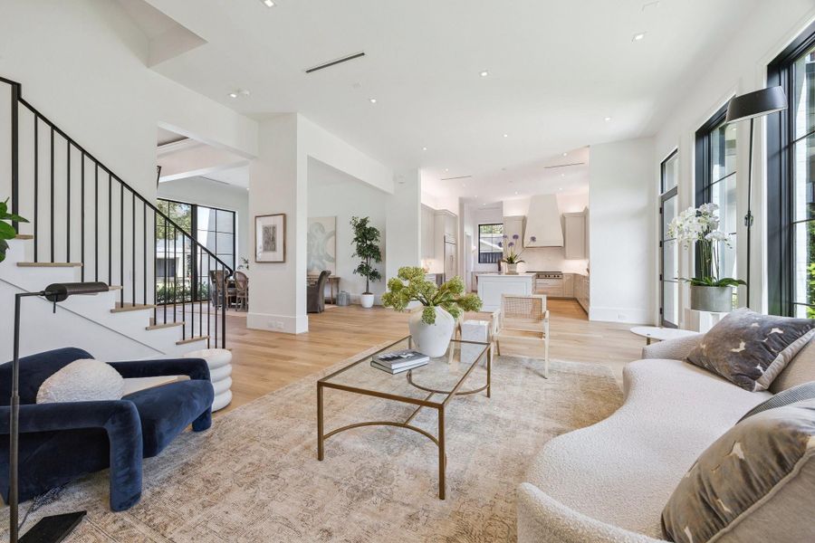 Family looking into the kitchen and dining room. Family looking into the kitchen and dining room.