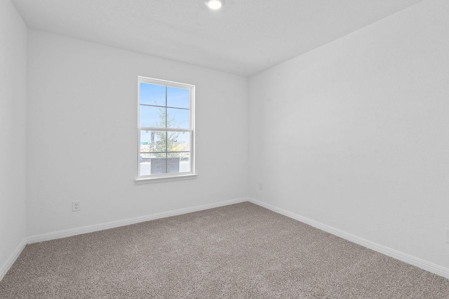 Spare room with baseboards and carpet floors Spare room with baseboards and carpet floors