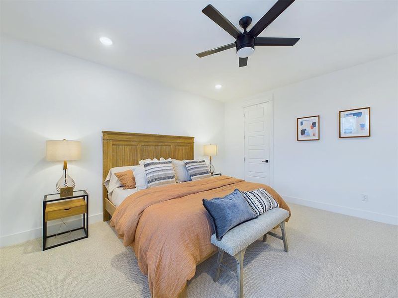 Elegant Primary Bedroom located on the 2nd floor. The high ceilings, with recessed lighting, are prewired and blocked for ceiling fans (not included).