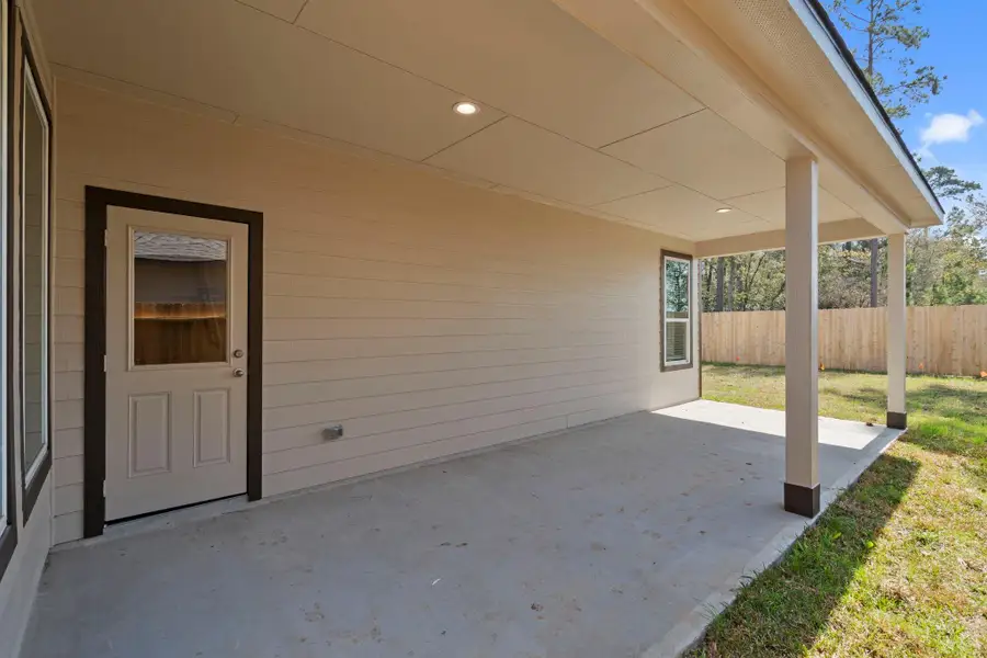 Exterior details and patio area of a home in Cypresswood Landing, Humble (Image 3).