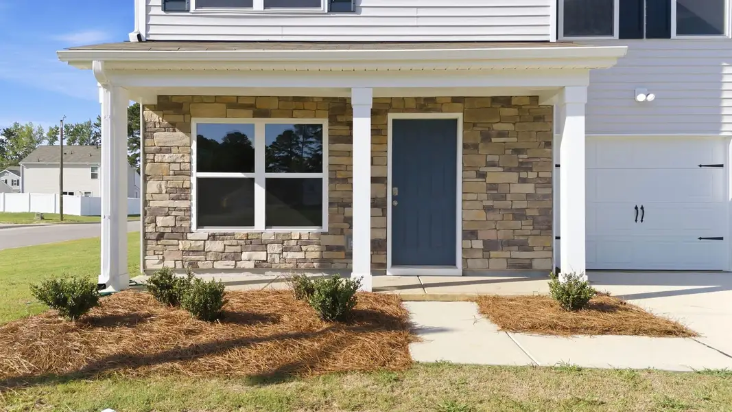 Exterior details and patio area of a home in Hobbs Farm, Ayden (Image 3).