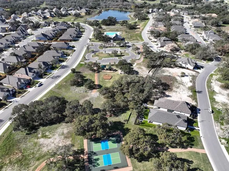 Aerial overview of property's location featuring nearby suburban area and a large body of water