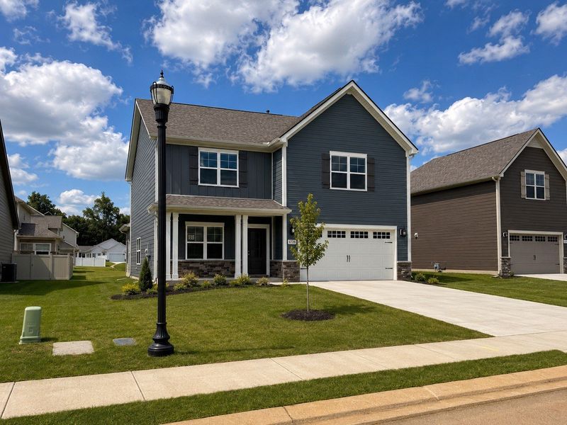 Front exterior of a new home in Salem Landing, Rockvale, TN, highlighting curb appeal (Image 17). Front exterior of a new home in Salem Landing, Rockvale, TN, highlighting curb appeal (Image 17).