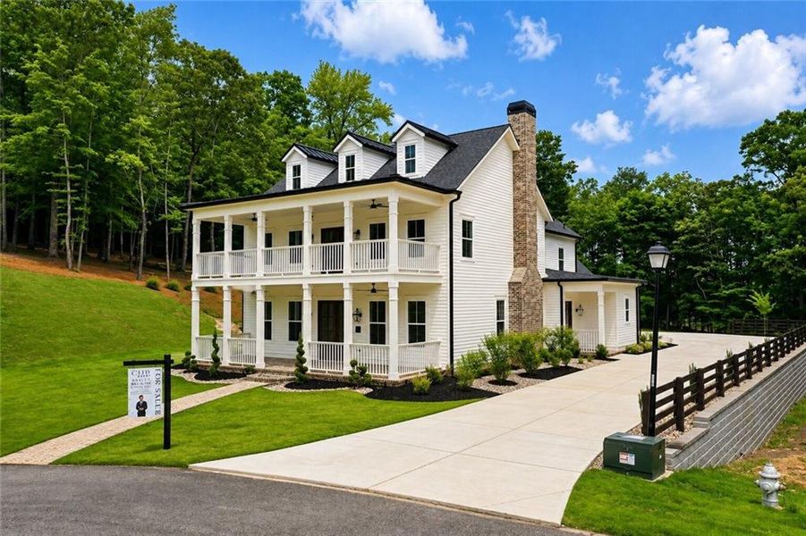 Front exterior of a new home in , Dacula, GA, highlighting curb appeal (Image 30). Front exterior of a new home in , Dacula, GA, highlighting curb appeal (Image 30).