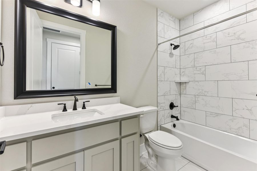 Full bathroom with washtub / shower combination and vanity Full bathroom with washtub / shower combination and vanity