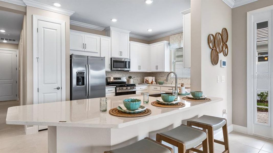 Furnished interior view inside a new home in Esplanade at Wiregrass Ranch, Wesley Chapel (Image 22).