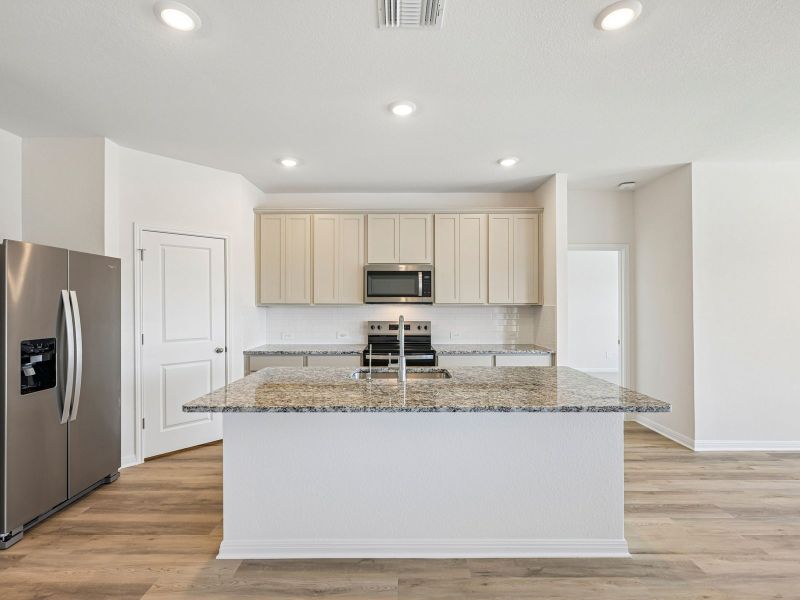 Furnished interior view inside a new home in Creekfall, Burnet (Image 5).