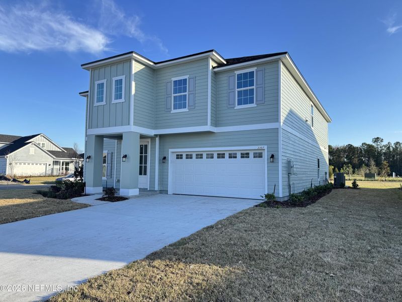 Front exterior of a new home in Hyland Trail, Green Cove Springs, FL, highlighting curb appeal (Image 2). Front exterior of a new home in Hyland Trail, Green Cove Springs, FL, highlighting curb appeal (Image 2).