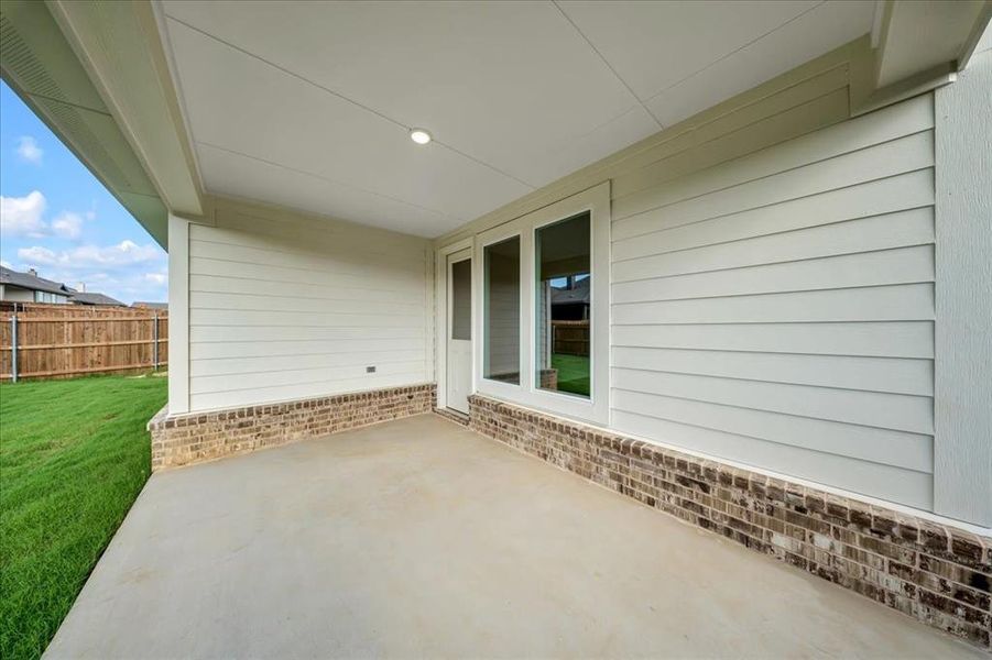Front exterior of a new home in Liberty Pointe, Gainesville, TX, highlighting curb appeal (Image 2).