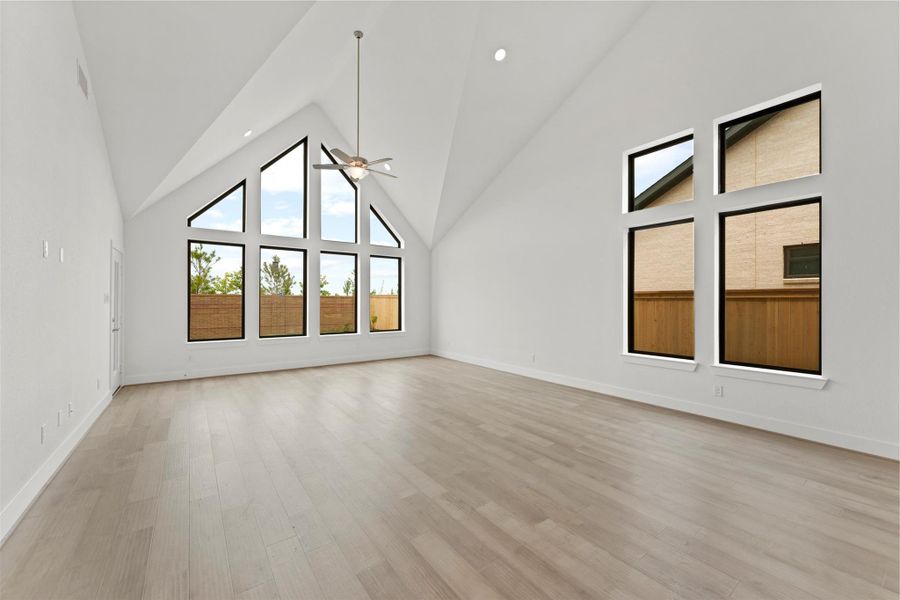 ** REPRESENTATION PHOTO OF THE SAME FLOOR PLAN, FINISHES WILL VARY** Gorgeous soaring high vaulted ceilings in the family room.