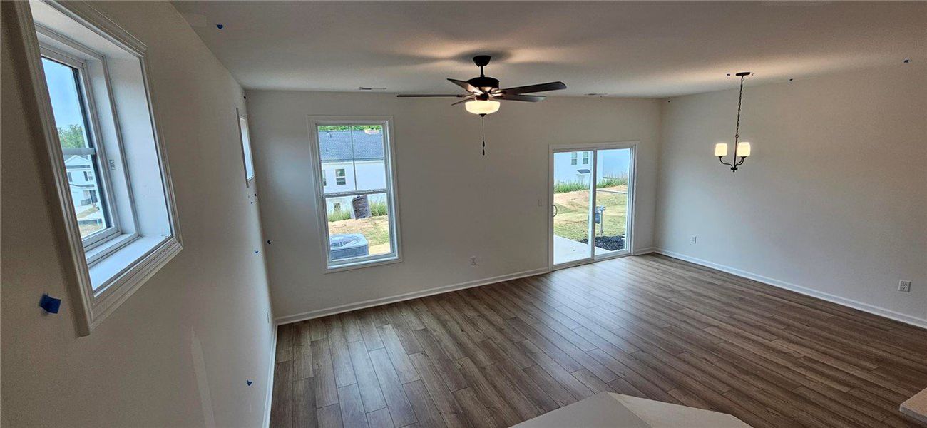 This bright room features a ceiling fan, durable f This bright room features a ceiling fan, durable f