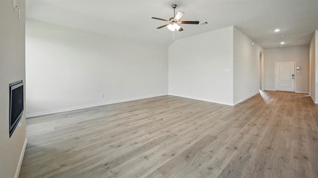 Unfurnished living room featuring light wood-type flooring, recessed lighting, and a ceiling fan