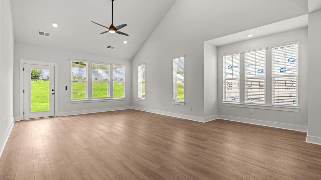 First-rate family room with eye-catching two-story ceilings and superior architectural detail