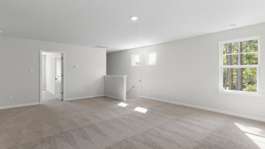 Representative unfurnished interior of a home built from the WOODSTOCK by D.R. Horton in Surfside Landing, Hubert (Image 26).
