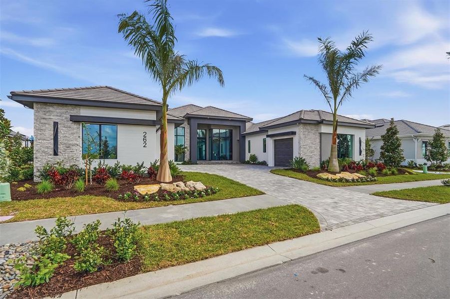 Front exterior of a new home in , Sarasota, FL, highlighting curb appeal (Image 22).