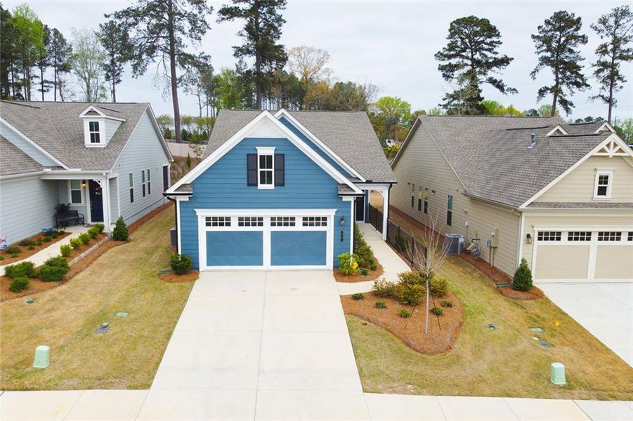 Front exterior of a new home in , Hoschton, GA, highlighting curb appeal (Image 18).