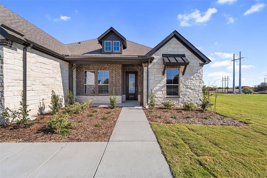 Front exterior of a new home in Parker Heights, Valley View, TX, highlighting curb appeal (Image 26). Front exterior of a new home in Parker Heights, Valley View, TX, highlighting curb appeal (Image 26).