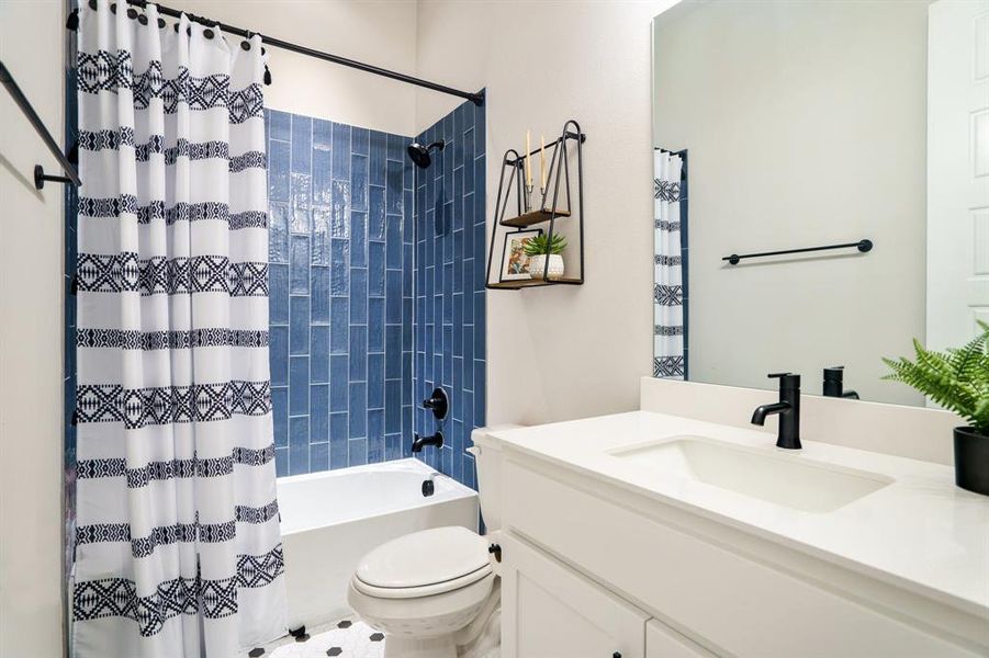 Full bath with vanity, toilet, and shower / tub combo Full bath with vanity, toilet, and shower / tub combo