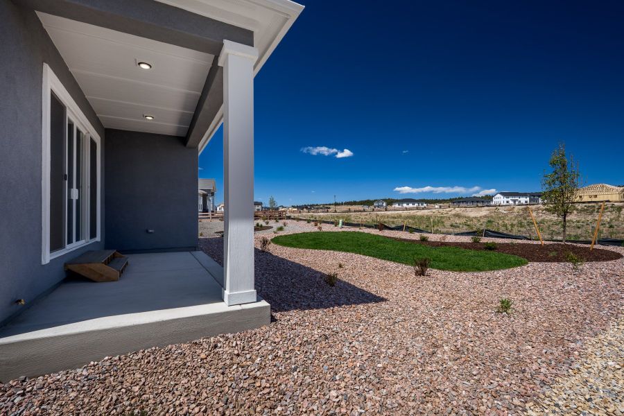 Exterior details and patio area of a home in Wolf Ranch - Enclave Collection, Colorado Springs (Image 3).
