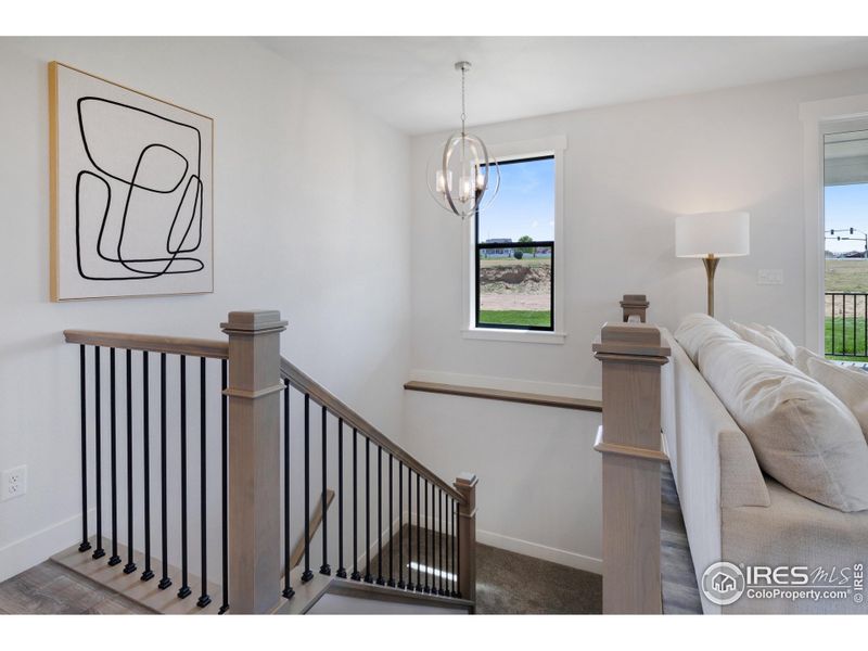 Stylish wrought-iron bannisters leading to the basement