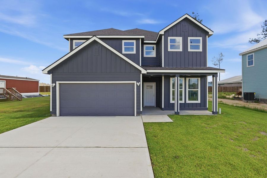 Front exterior of a new home in , Conroe, TX, highlighting curb appeal (Image 2).