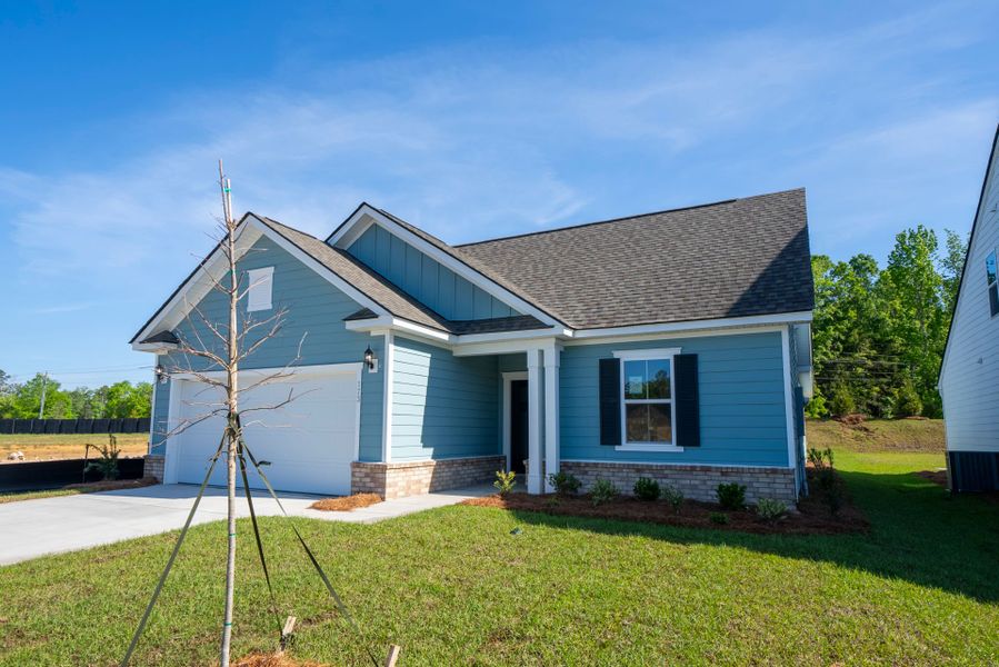 Front exterior of a new home in Monroe Preserve, Chapin, SC, highlighting curb appeal (Image 26). Front exterior of a new home in Monroe Preserve, Chapin, SC, highlighting curb appeal (Image 26).