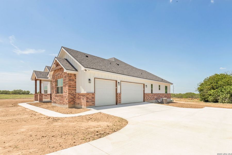 Front exterior of a new home in , Seguin, TX, highlighting curb appeal (Image 20).