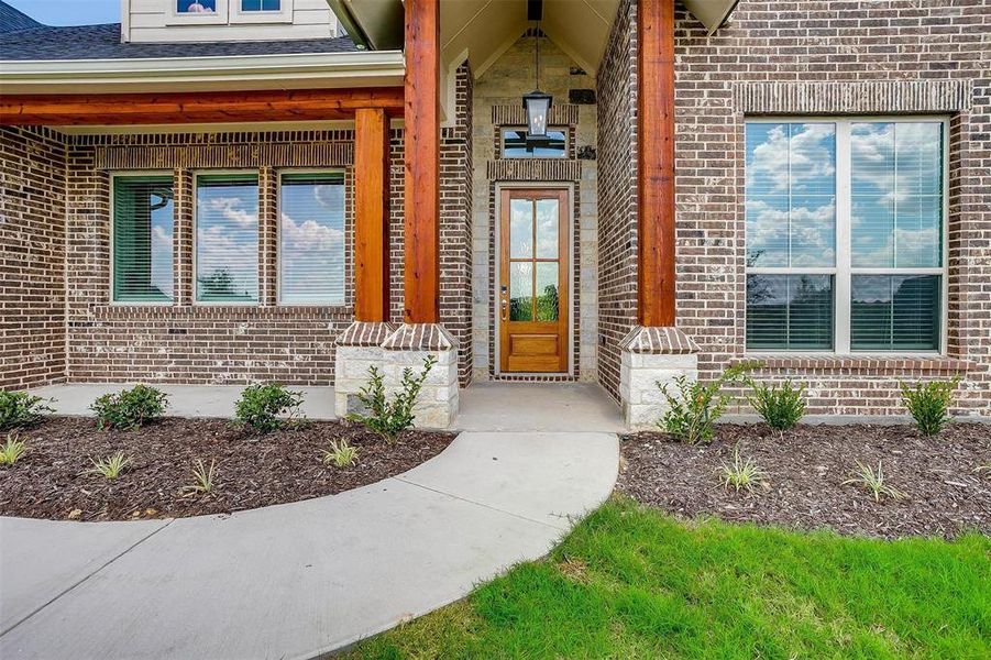 Entrance to property featuring a porch