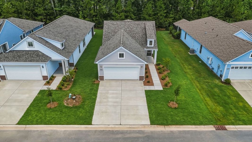 Front exterior of a new home in Sun City Hilton Head, Bluffton, SC, highlighting curb appeal (Image 23). Front exterior of a new home in Sun City Hilton Head, Bluffton, SC, highlighting curb appeal (Image 23).