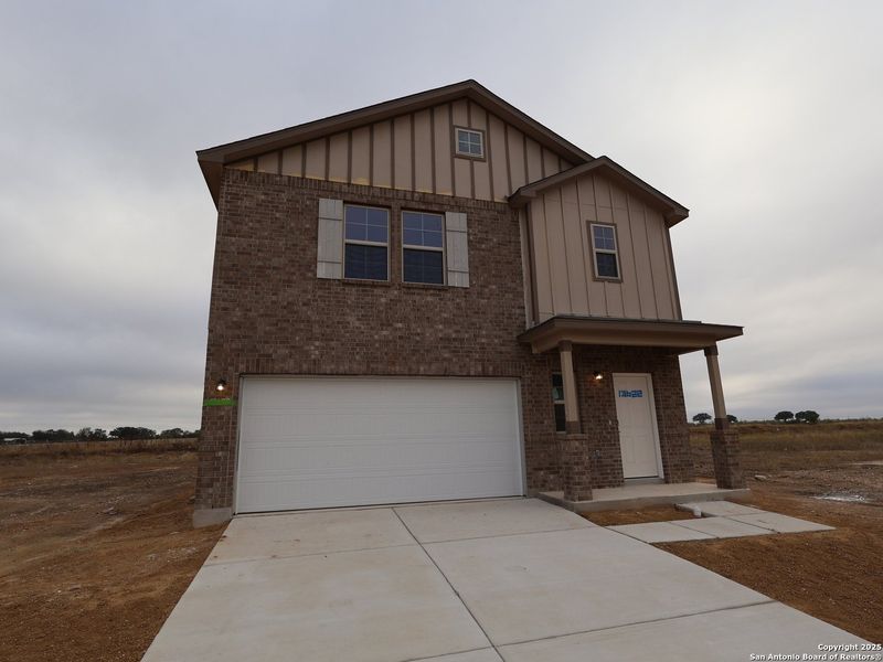 Front exterior of a new home in Winding Brook, San Antonio, TX, highlighting curb appeal (Image 1). Front exterior of a new home in Winding Brook, San Antonio, TX, highlighting curb appeal (Image 1).