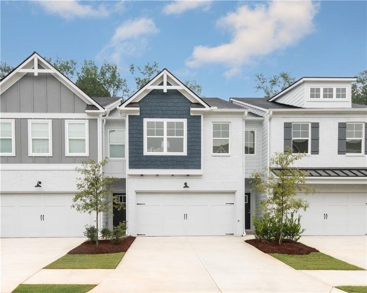 Front exterior of a new home in Shoals Crossing, Conyers, GA, highlighting curb appeal (Image 1). Front exterior of a new home in Shoals Crossing, Conyers, GA, highlighting curb appeal (Image 1).