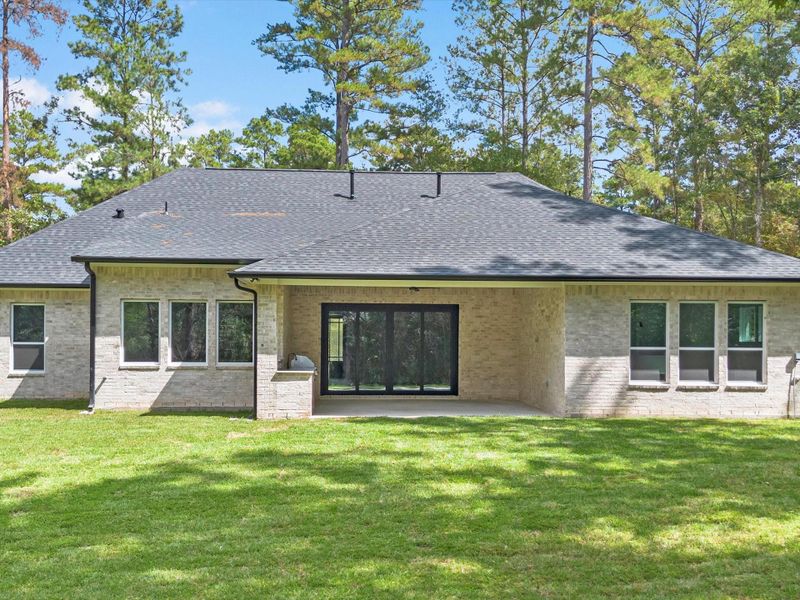 Exterior details and patio area of a home in , New Waverly (Image 17). Exterior details and patio area of a home in , New Waverly (Image 17).