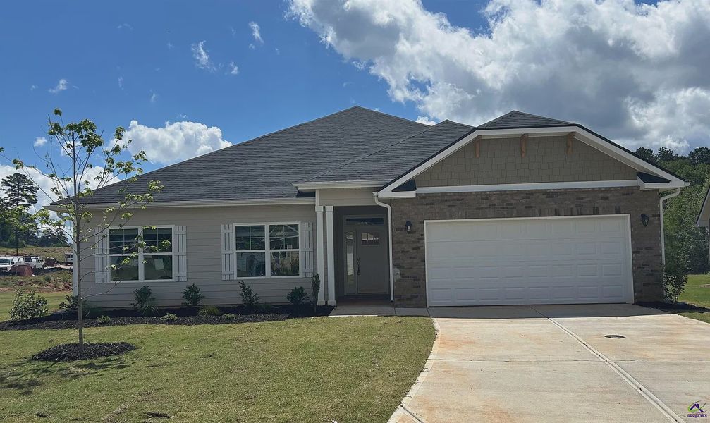 Front exterior of a new home in Barrington Place, Macon, GA, highlighting curb appeal (Image 1). Front exterior of a new home in Barrington Place, Macon, GA, highlighting curb appeal (Image 1).