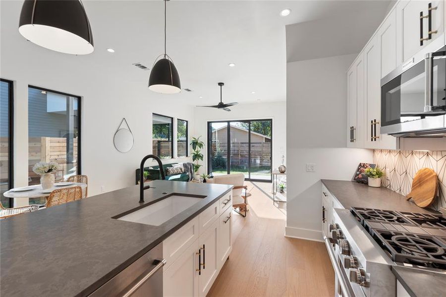 The kitchen and living room flow to the outdoor covered patio